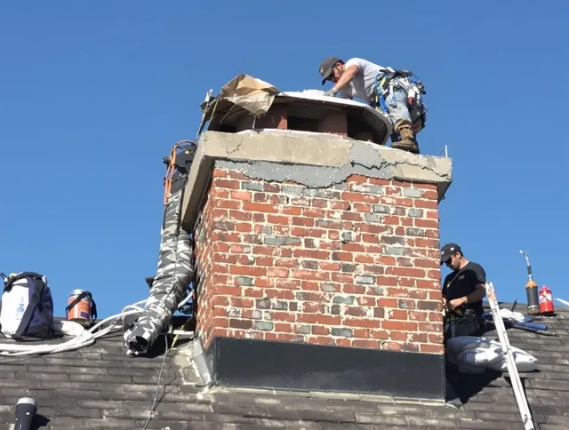 Lake Wylie Chimney Sweep installing a custom chimney crown in Lake Wylie, SC