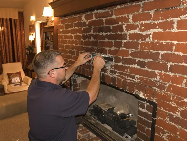 Lake Wylie Chimney Sweep expert fixing a fireplace in Lake Wylie, SC